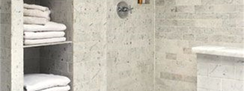 marble look tile shower and floor